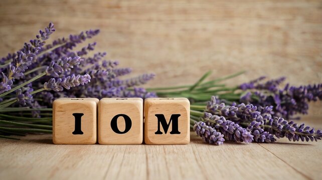 Lavender bouquet with IOM wooden blocks on rustic wood background