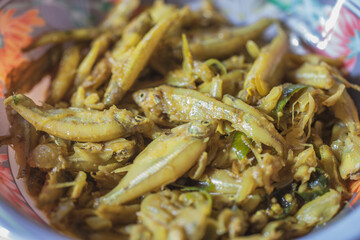 A heap of freshly caught small fish showcases abundance at a local fish market or coastal catch station.