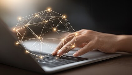 Hands typing on a laptop with a glowing network graphic overlay