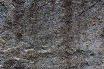 Obraz premium Rough surface of gray rock texture background. Close up of weathered natural stone texture.