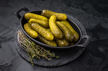 Homemade brined cucumbers, Pickled Gherkins, offering a deliciously crunchy bite that complements...