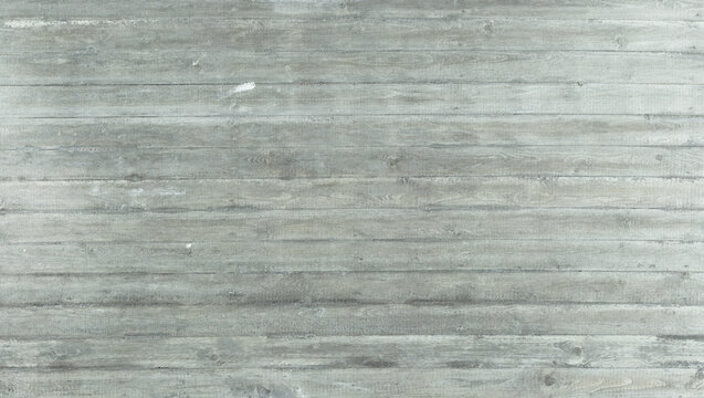 Gray exposed concrete wall with molded wood grain &ndash; characteristic structure visible through board formwork.