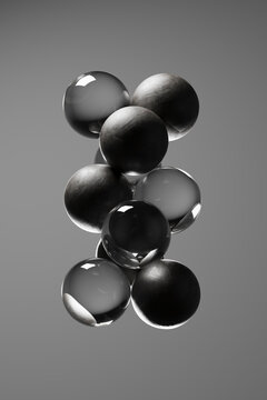Floating glass marbles in abstract 3d composition on gray background