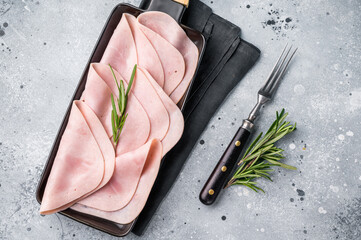 Gourmet sliced ham on a rustic board, inviting you to explore delicious recipes and delightful...
