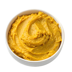 Turmeric and ginger paste in a bowl, surrounded by ingredients