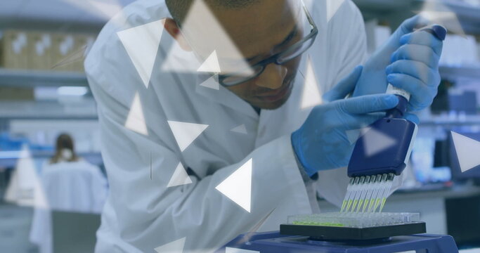 Dispensing technician wearing safety glasses, lab coat using pipette into microplate at lab bench - Powered by Adobe
