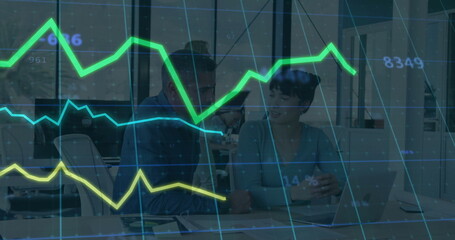 Reviewing metrics two colleagues analyzing laptop in open office, with neon line charts