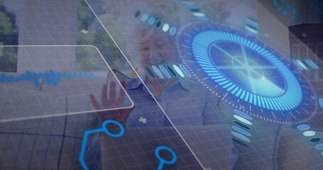 Reaching senior woman touching holographic controls on sofa in living room, with graphs