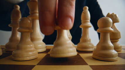 Gamer fingers shifting chess on competition grid closeup. Logic match challenge