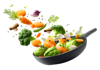 Colorful Assorted vegetables falling into a black frying pan, Healthy cooking isolated on a transparent background