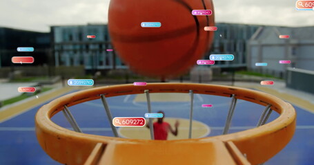 Basketball hovering above orange hoop rim on blue and yellow court, with data tags tracking motion