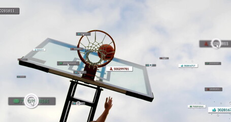 Falling basketball going through hoop net while arm reaching at outdoor court with digital overlay