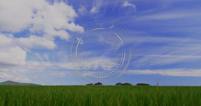 Fototapeta Showing lush green grass stretching across landscape with hills, with translucent digital overlay