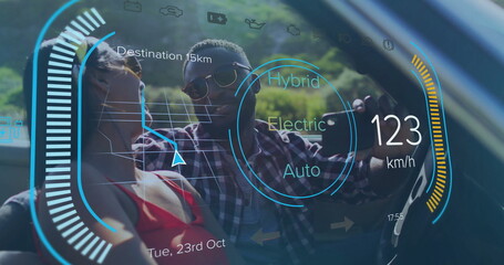 Man and woman wearing sunglasses taking smartphone selfie in car, with head-up navigation display