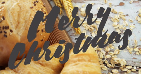 Showing pastries with seeded roll, croissants on table with oat flakes Merry Christmas overlay