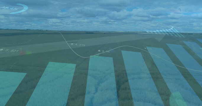 Fototapeta Showing line graph, bar chart with numeric labels and upward arrow over crop field under clouds