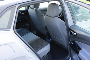Rear leather passenger seats in electric car. Leather car passenger seat. Car interior detail