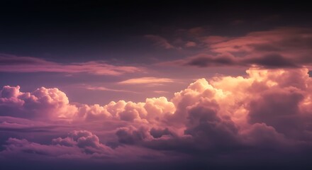 Fototapeta premium Dramatic and colorful skyscape with vibrant pink, purple, and golden clouds during a beautiful sunset or sunrise.