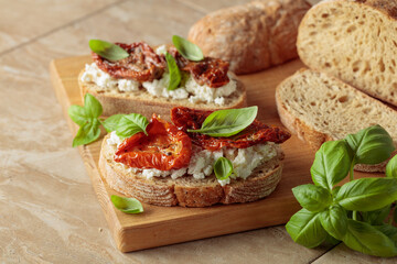 Ciabatta with sun dried tomatoes in olive oil, ricotta, and basil.