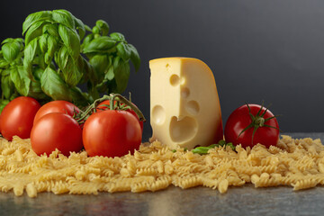 Ingredients for preparing traditional Italian pasta with cheese.