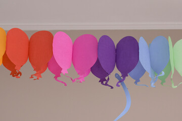Colorful party balloons decorated along a festive room for a celebration in the afternoon