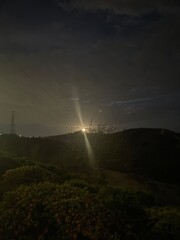 Bright Moon Peaks through Hills