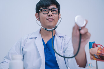 In the bustling hospital, the doctor used a stethoscope to listen to the patient's heartbeat during...