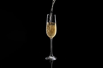 Golden Champagne Pouring into an Elegant Flute Glass Against a Striking Black Backdrop