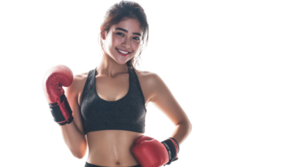A young woman smiling in boxing gloves, showcasing strength and confidence in sports.