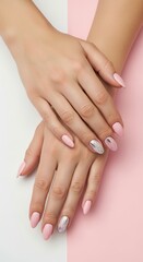 Fototapeta premium Elegant pink manicure with silver chrome accents, feminine hands with almond shaped nails, professional nail art on pastel background