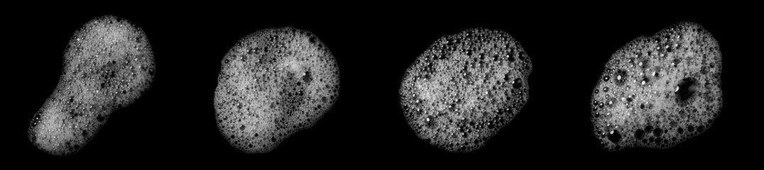 Abstract soap bubbles. Set of soap bubbles. Shampoo or shower gel. Separate soap bubbles on black background. Contrast background. 