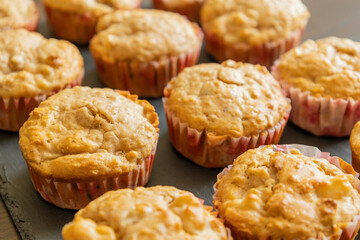 delicious pear muffin captured in close-up with a warm golden glow, perfect for autumn baking themes