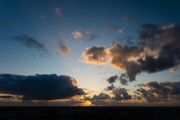 Stunning sunset scene featuring colorful clouds and a serene landscape, creating a peaceful atmosphere and captivating view