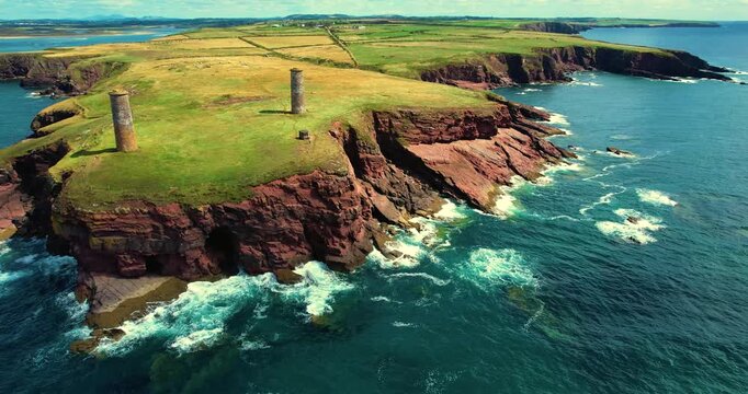 A slight drone sliding shot of Brownstown Head cliffs towards Wexford