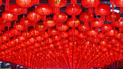 Ceiling filled with glowing red Chinese lanterns celebrating Lunar New Year.