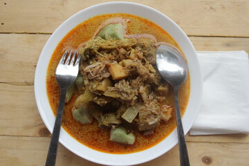 a plate of lontong lodeh