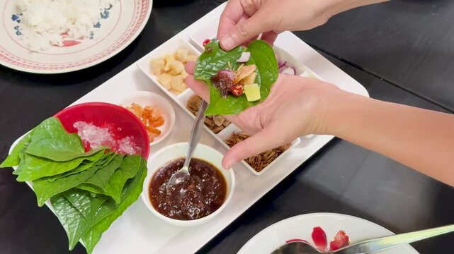 Preparing Miang Kham Savory Leaf Wraps in Thai Kitchen