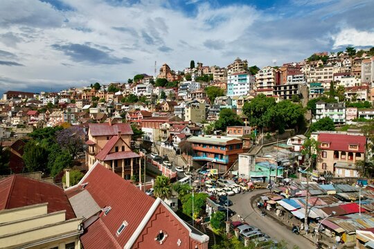 Market Stalls and Parked Peugeots Below Ambohijatovo&rsquo;s Terraced Rise | Antananarivo | TNR