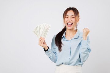 Excited happy Woman cheers with dollar money fan, radiating happiness and excitement from her lucky...
