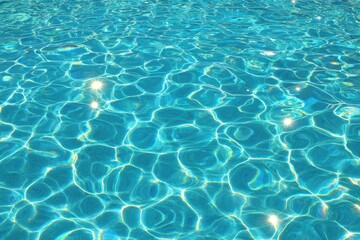 Obraz premium Rippled turquoise pool water, sunlit reflections
