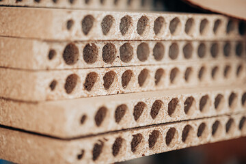 Perforated Particle Boards Stacked for Furniture Construction