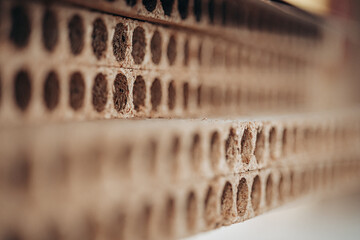 Perforated Particle Boards Stacked for Furniture Construction