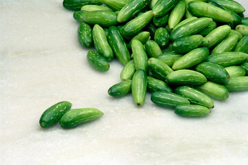 green jerkins vegetable white background