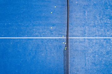 overhead perspective of a clean blue padel court with minimal elements