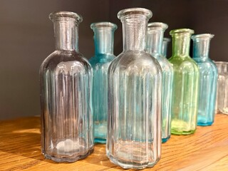 Stylish small glass bottles with designer look. Perfect for home decor, DIY crafts, oils, natural beauty, table settings, or seasonal inspiration