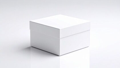 Fototapeta premium Clean white cardboard box with a lid resting on pristine white background for product packaging or storage.