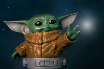 Naklejka premium Closeup of Grogu action figure fictional character from the original television series The Mandalorian from the Star Wars franchise