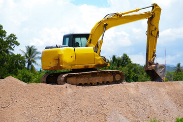 The excavator is digging a sand.