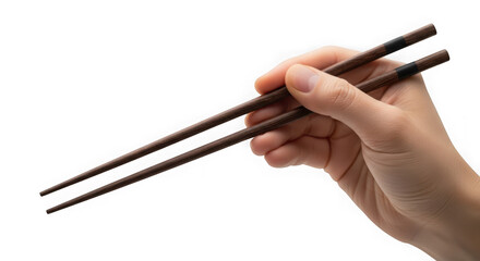 Close up of a hand holding wooden chopsticks against a transparent background ready to serve food