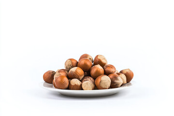 a plate of nuts on a white surface